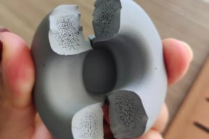 Cross-section inspection of a defective custom silicone rubber plug showing internal material structure