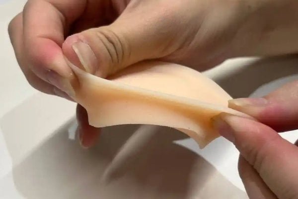 low hardness silicone sheet with an oily surface