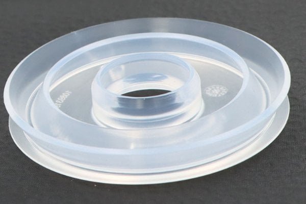 silicone flange seals for drug delivery systems